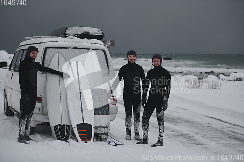 Image of Arctic surfers in wetsuit after surfing by minivan