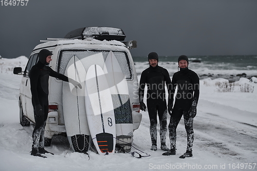 Image of Arctic surfers in wetsuit after surfing by minivan