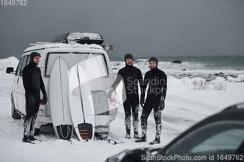 Image of Arctic surfers in wetsuit after surfing by minivan