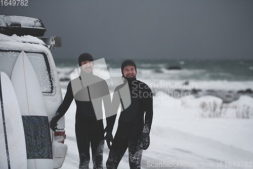 Image of Arctic surfers in wetsuit after surfing by minivan