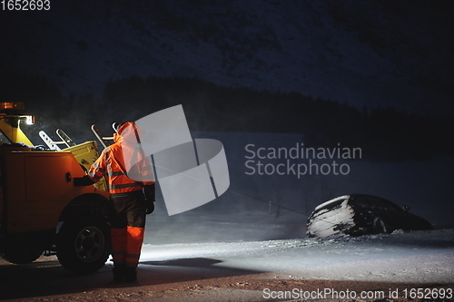 Image of Car being towed after accident in snow storm