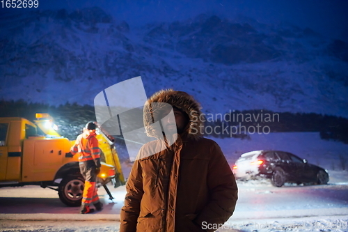 Image of rescued man after car accident in winter