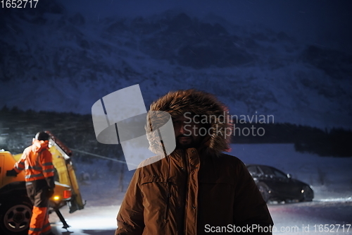 Image of rescued man after car accident in winter