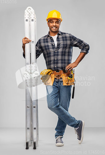 Image of happy indian builder in helmet with ladder