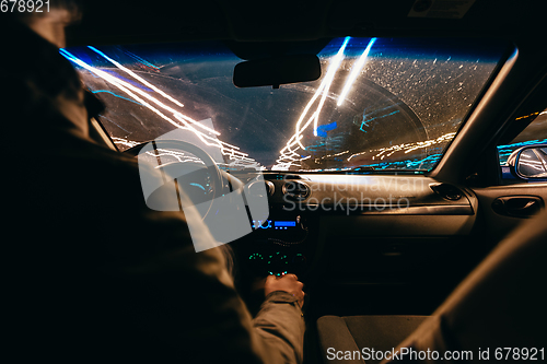 Image of Riding through the city by car