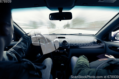 Image of driving a car on winter road