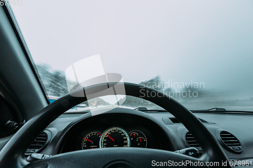Image of Riding behind the wheel of a car in winter