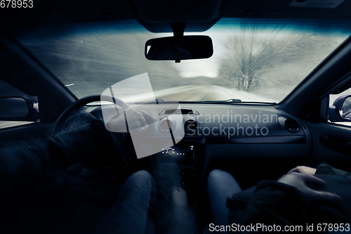 Image of driving a car on winter road