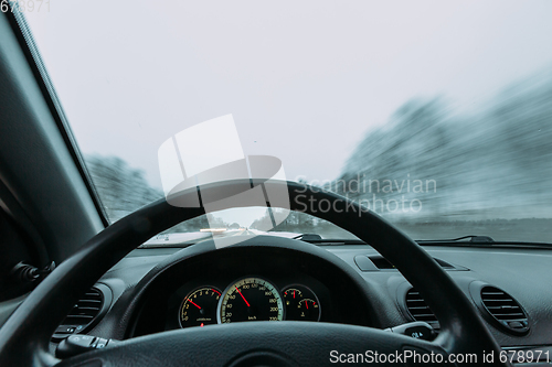 Image of Riding behind the wheel of a car in winter