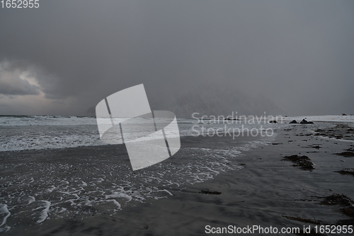 Image of norway coast in winter with snow bad cloudy weather