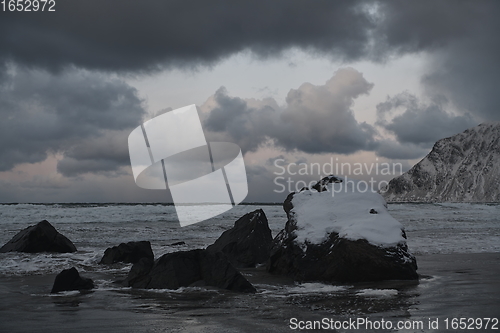 Image of norway coast in winter with snow bad cloudy weather