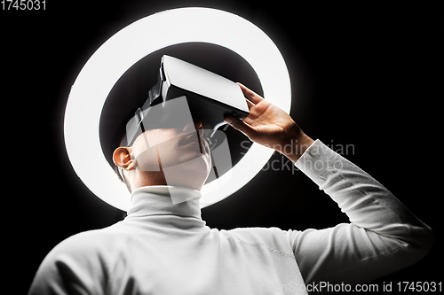 Image of man in virtual reality headset or vr glasses