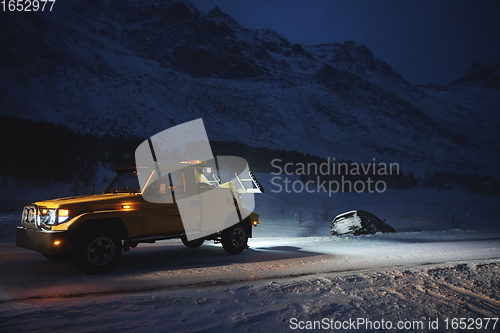 Image of Car being towed after accident in snow storm