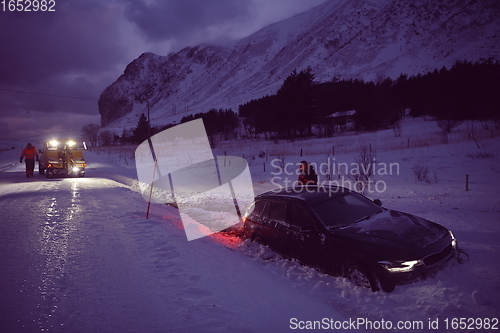 Image of Car being towed after accident in snow storm