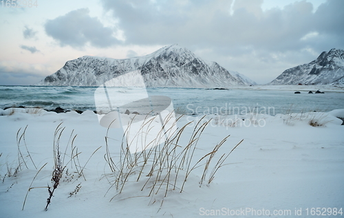 Image of norway coast in winter with snow bad cloudy weather