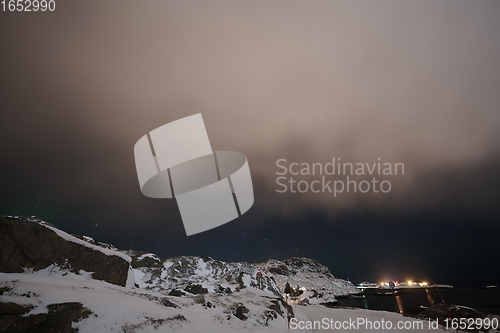 Image of Aurora borealis Green northern lights above mountains