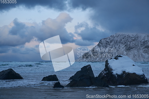 Image of norway coast in winter with snow bad cloudy weather