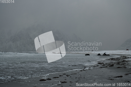 Image of norway coast in winter with snow bad cloudy weather