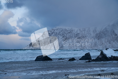 Image of norway coast in winter with snow bad cloudy weather