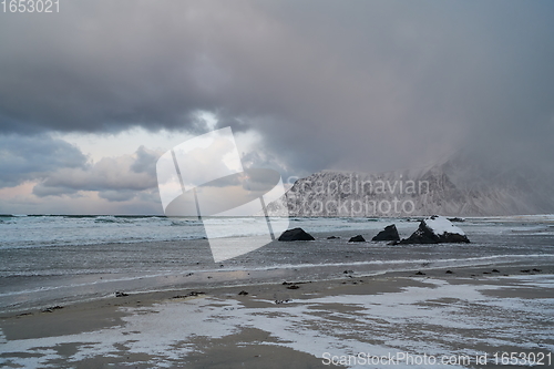 Image of norway coast in winter with snow bad cloudy weather