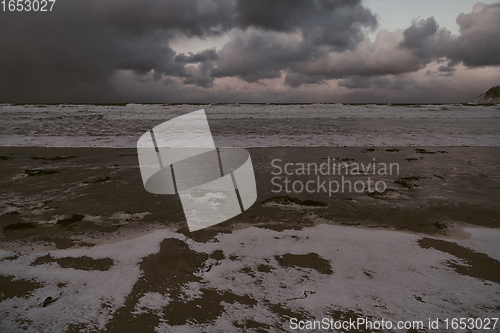 Image of norway coast in winter with snow bad cloudy weather