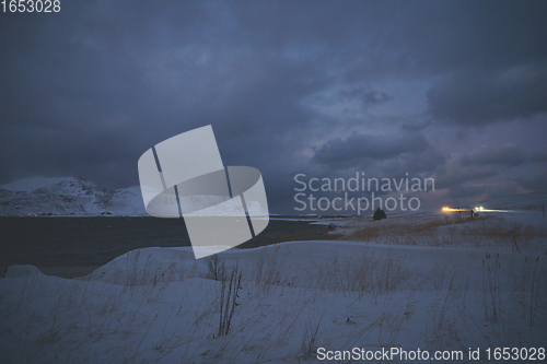 Image of norway coast in winter with snow bad cloudy weather