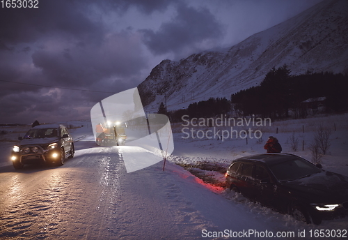 Image of Car being towed after accident in snow storm