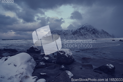 Image of norway coast in winter with snow bad cloudy weather