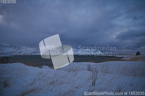 Image of norway coast in winter with snow bad cloudy weather