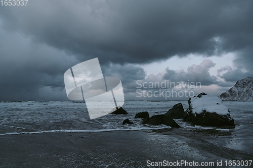 Image of norway coast in winter with snow bad cloudy weather