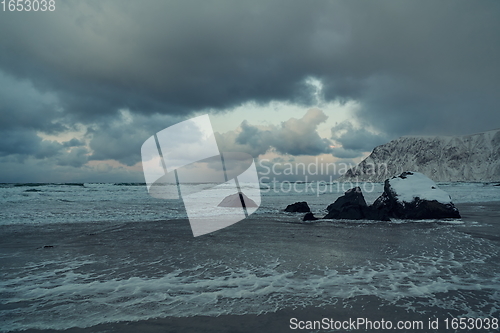 Image of norway coast in winter with snow bad cloudy weather