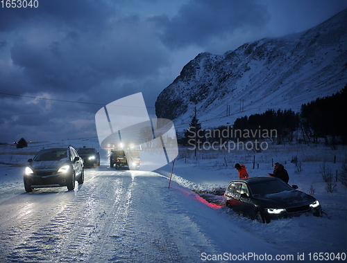 Image of Car being towed after accident in snow storm