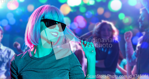 Image of happy woman in pink wig and black sunglasses