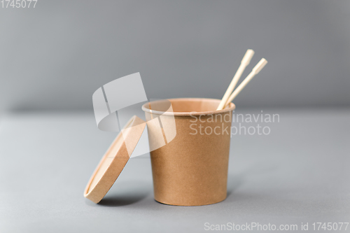 Image of paper container for takeaway food with chopsticks