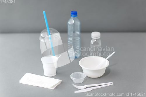 Image of disposable plastic dishes on table