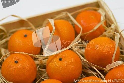 Image of tangerines with straw