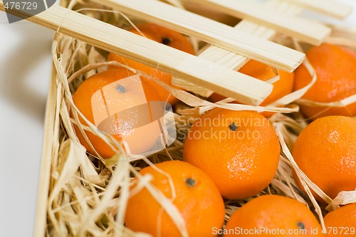 Image of tangerines with straw