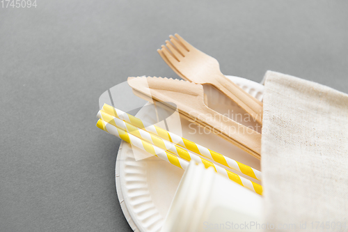 Image of wooden forks, knives, paper straws and cups