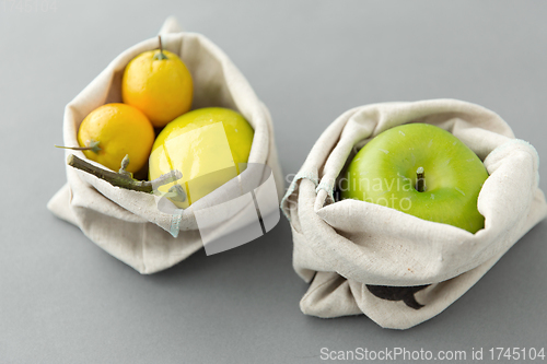 Image of fruits in reusable canvas bags for food shopping