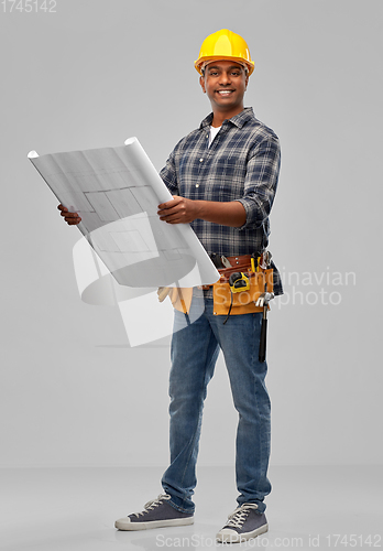 Image of happy indian builder in helmet with blueprint