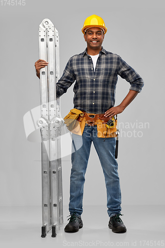 Image of happy indian builder in helmet with ladder