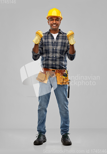 Image of indian worker or builder in helmet and gloves