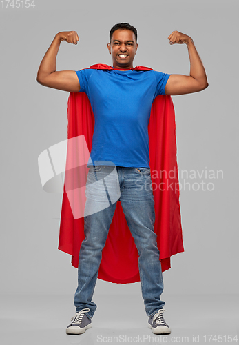 Image of indian man in superhero cape showing his power