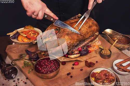 Image of Roasted goose with herbs berries and vegetables