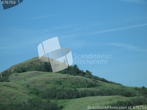 Image of green hill and blue sky