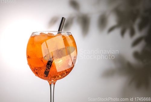 Image of glass of orange cocktail