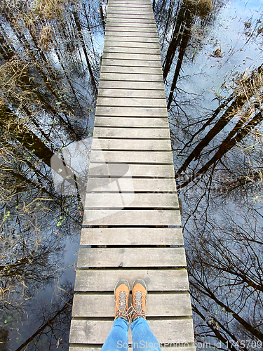 Image of wooden footbridge through the lake nature trail