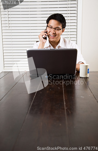 Image of Asian entrepreneur on the phone