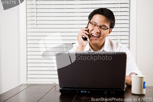 Image of Asian entrepreneur on the phone