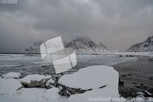 Image of norway coast in winter with snow bad cloudy weather